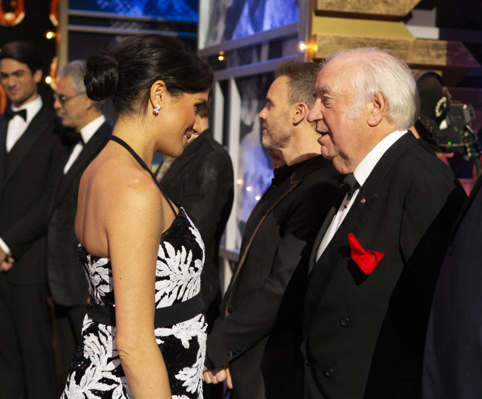 The Duchess of Sussex meets Jimmy Tarbuck on stage at the Royal Variety Performance at the London Palladium in central London.