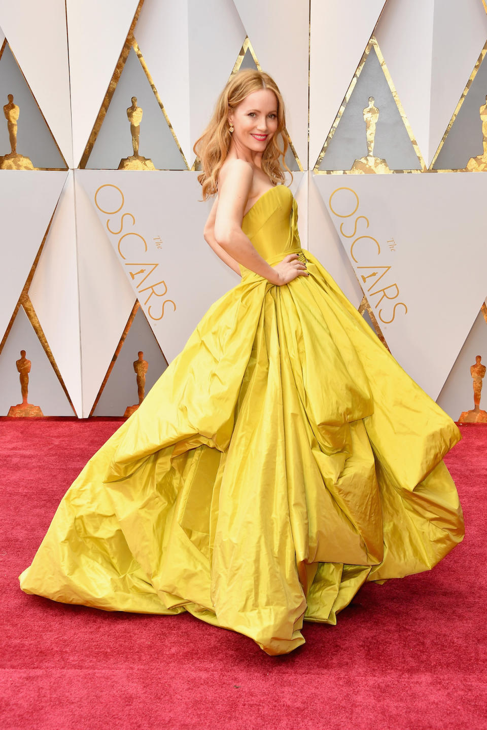 <p>Leslie Mann channelled Belle from <em>Beauty and the Beast </em>for the Oscars in a yellow Zac Posen gown. <em>(Photo: Getty Images)</em> </p>