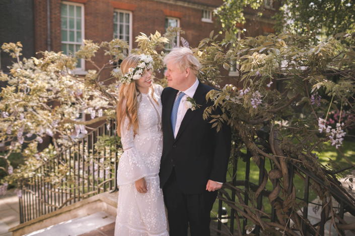Boris and Carrie Johnson are seen in the garden of 10 Downing Street, after their wedding, in London, Britain May 29, 2021. Picture taken May 29, 2021. Rebecca Fulton/Pool via REUTERS     TPX IMAGES OF THE DAY