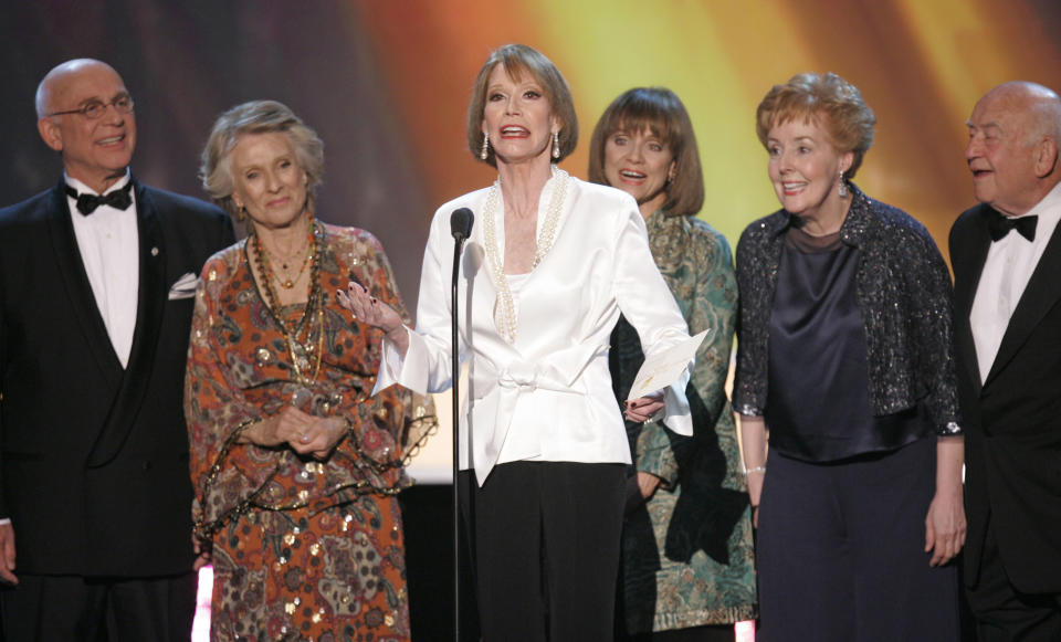 FILE - In this Jan. 2007 file photo, the cast of "The Mary Tyler Moore Show," from left, Gavin MacLeod, Cloris Leachman, Mary Tyler Moore, Valerie Harper, Georgia Engel and Ed Asner, present the award for outstanding performance by an ensemble in a comedy series at the 13th Annual Screen Actors Guild Awards, in Los Angeles. The 82-year-old MacLeod's autobiography, “This is Your Captain Speaking,” will be released Tuesday, Oct. 22, 2013. (AP Photo/Mark J. Terrill, File)