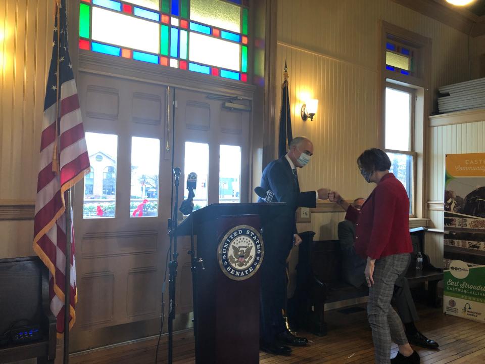 U.S. Sen. Bob Casey (D-Pa.) and state Rep. Maureen Madden (D-115) fist bump as Madden steps up to speak at Dansbury Depot in East Stroudsburg on Monday, Nov. 29, 2021.