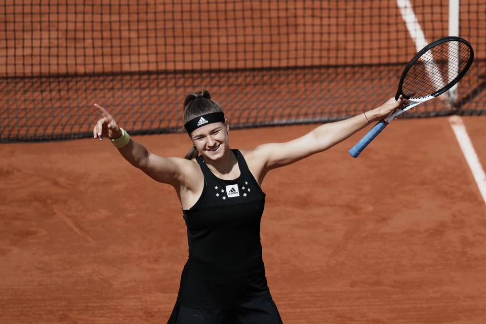 Karolina Muchova of the Czech Republic reacts after defeating Greece's Maria Sakkari during their second round match of the French Open tennis tournament at the Roland Garros stadium Wednesday, May 25, 2022 in Paris. Muchova won 7-6, 7-6. (AP Photo/Thibault Camus)