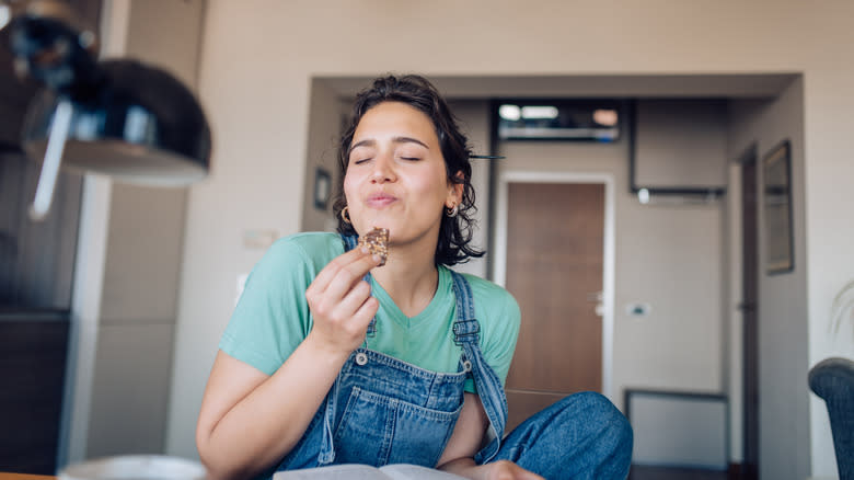 Person eating a cookie