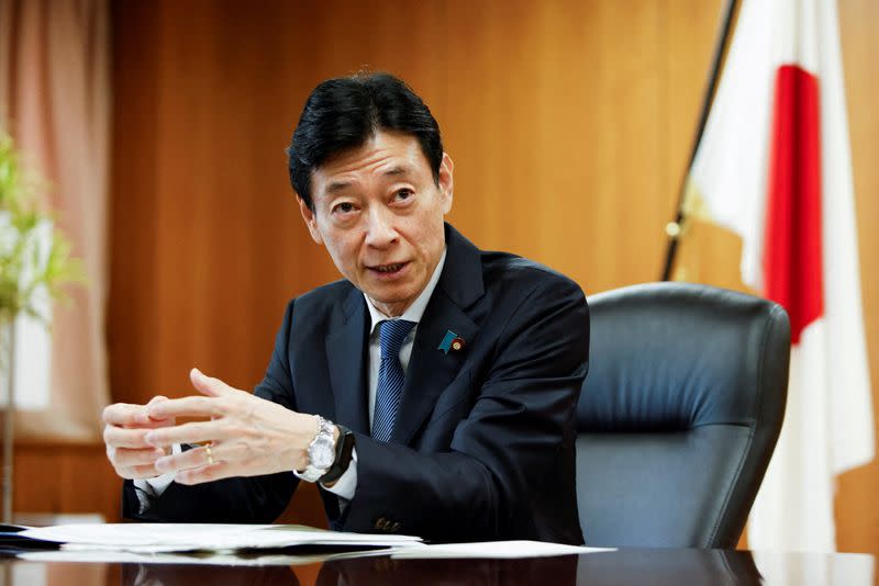FILE PHOTO: Nishimura Yasutoshi, Minister of Economy, Trade and Industry (METI), talks during an interview with Reuters in Tokyo