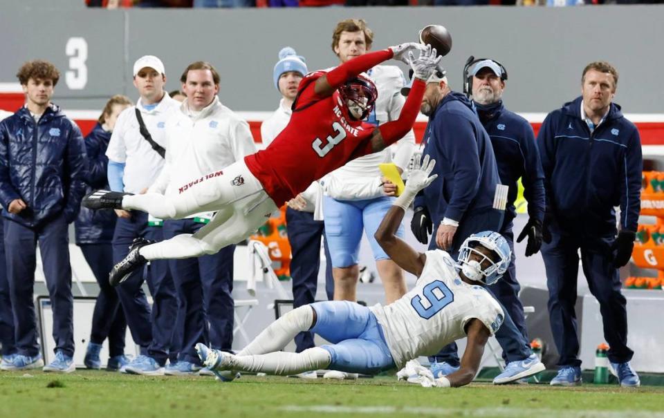 N.C. State cornerback Aydan White (3) can’t pull in a pass intended for North Carolina wide receiver Tez Walker (9) during the first half of N.C. State’s game against UNC at Carter-Finley Stadium in Raleigh, N.C., Saturday, Nov. 25, 2023.