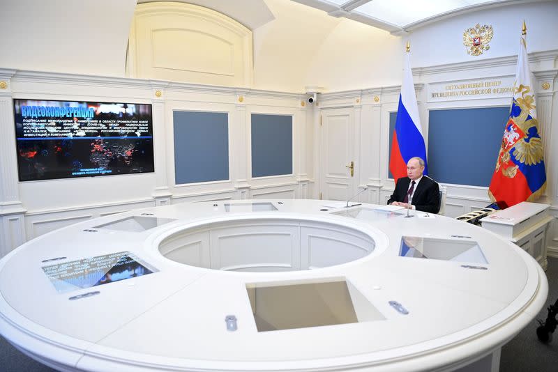 Russian President Vladimir Putin attends a meeting on AstraZeneca and Gamaleya Institute memorandum of intent on cooperation