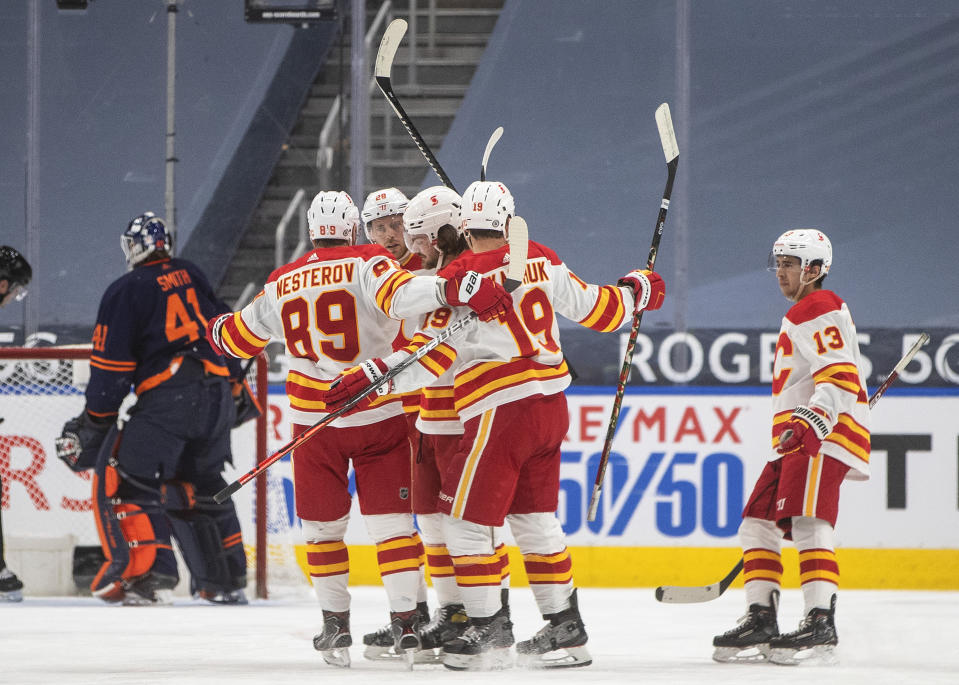 Edmonton Oilers' goalie Mike Smith (41) looks to the net as the Calgary Flames celebrate a goal during the second period of an NHL hockey game, Thursday, April 29, 2021 in Edmonton, Alberta. (Jason Franson/Canadian Press via AP)