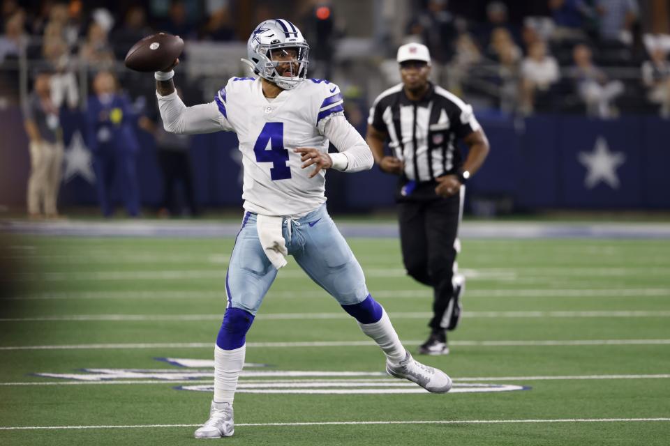 Dallas Cowboys quarterback Dak Prescott (4) throws a pass in the second half of a NFL football game against the Tampa Bay Buccaneers in Arlington, Texas, Sunday, Sept. 11, 2022. (AP Photo/Ron Jenkins)