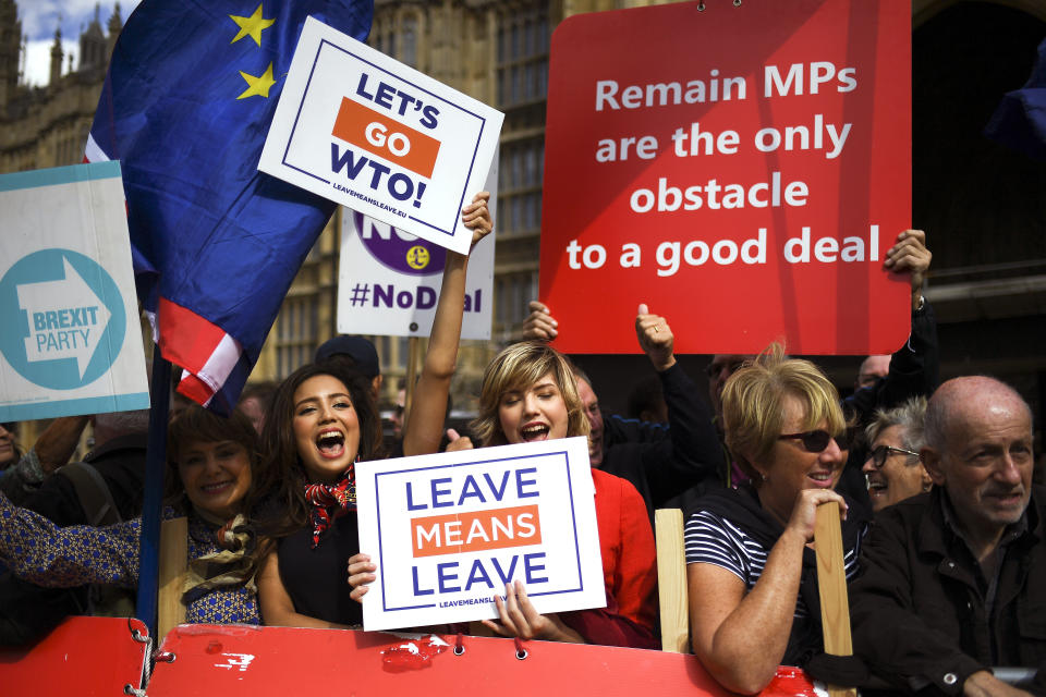 Pro-Brexit supporters outside the Houses of Parliament, in London, Wednesday, Sept. 4, 2019. The European Union is warning businesses and people likely to be hit by Brexit to make sure they are prepared for the possibility that Britain might leave the bloc without an agreement at the end of next month. The EU's executive arm, the European Commission, on Wednesday released a checklist for companies to use to help minimize expected disruptions to trade after Britain departs on Oct 31. (AP Photo/Alberto Pezzali)