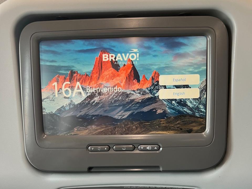 My seatback TV screen with 16A and a welcome sentence shown.