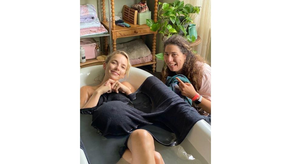 Jodie Comer with a baby bump in a bath filming The End We Start From