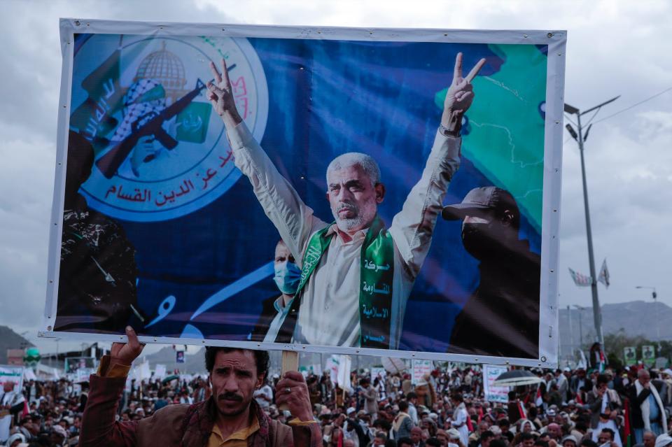 A supporter of the Iran-backed Houthi militia holds a poster of Yahya Sinwar during a protest marking Jerusalem Day in support of Palestinians in Yemen on April 5, 2024.