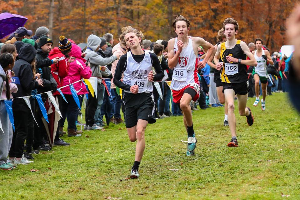 Vernon-Vernona-Sherrill's Keegan Bauer runs with Jonny Sherwood of Newark Valley and Nick Lyndaker of Canton during the state cross-country meet Saturday at Chenango Falls. Bauer finished in 11th place in Class with a time of 17:13.3.