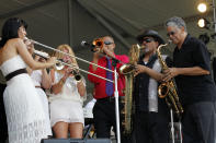 CORRECTS SPELLING OF FIRST NAME TO ALLEN INSTEAD OF ALLAN - Allen Toussaint's horn section performs at the New Orleans Jazz and Heritage Festival in New Orleans, Saturday, May 5, 2012. (AP Photo/Gerald Herbert)