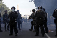 Police clear demonstrators from Lafayette Park as they protest the death of George Floyd, Monday, June 1, 2020, in Washington. Floyd died after being restrained by Minneapolis police officers. (AP Photo/Alex Brandon)