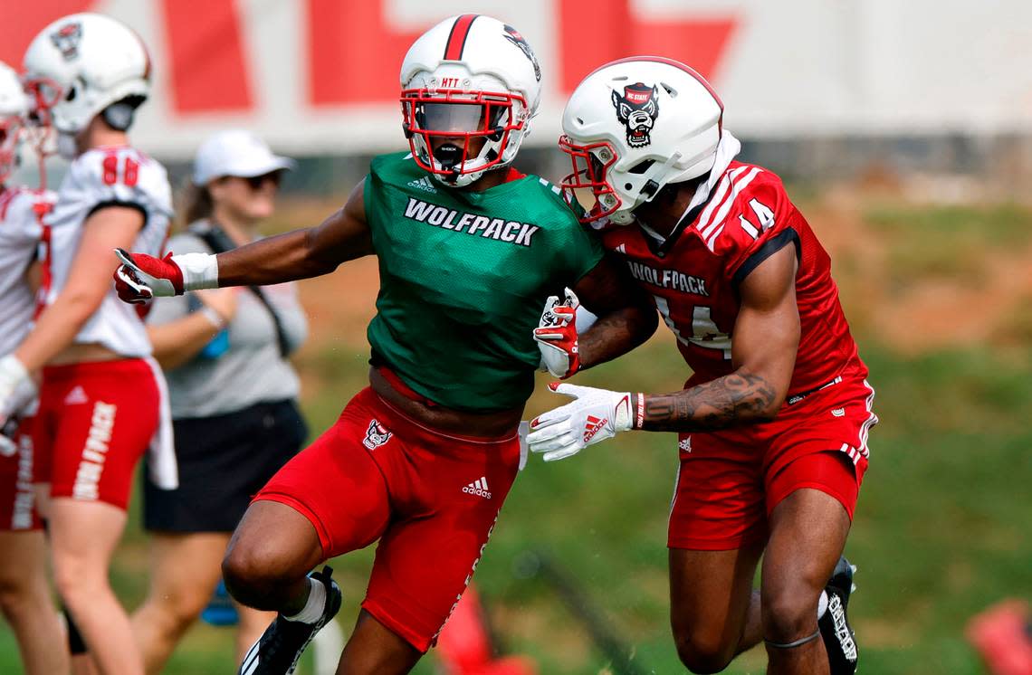 N.C. State cornerback Renté Hinton (14) defends wide receiver DJ Collins (86) during the Wolfpack’s first fall practice in Raleigh, N.C., Wednesday, August 2, 2023. Ethan Hyman/ehyman@newsobserver.com