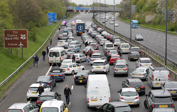 1.5.16..... The Southbound M56 Motorway near Manchester Airport was closed on Sunday eveing due to a man sat with his legs dangling over a bridge. Frustrated holiday makers stuck in the traffic jumped out of their cars and taxis and climbed the fence over the motorway in and attempt to get to the airport and catch their flight.