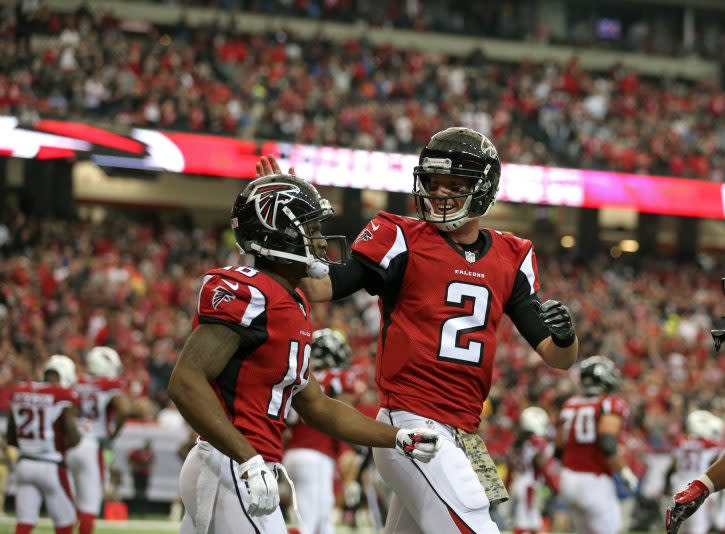 Nov 27, 2016; Atlanta, GA, USA; Atlanta Falcons quarterback Matt Ryan (2) celebrates the touchdown with wide receiver Taylor Gabriel (18) in the second quarter of their game against the Arizona Cardinals at the Georgia Dome. Mandatory Credit: Jason Getz-USA TODAY Sports