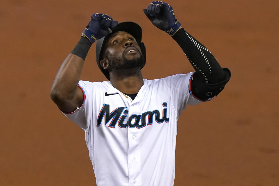Miami Marlins' Starling Marte reacts after hitting a single during the third inning of a baseball game against the Philadelphia Phillies, Monday, Sept. 14, 2020, in Miami. (AP Photo/Lynne Sladky)