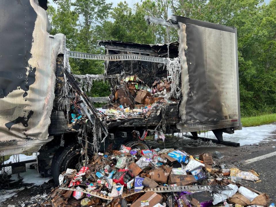 Goods from inside the truck seen on the interstate.