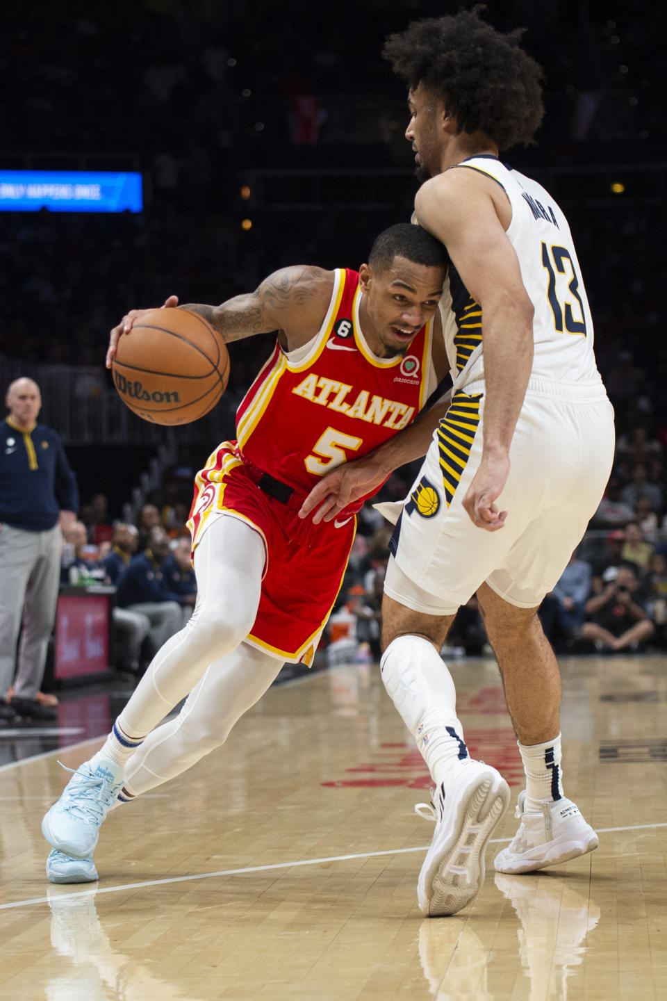 Atlanta Hawks guard Dejounte Murray drives to the basket against Indiana Pacers forward Jordan Nwora during the first half of an NBA basketball game, Saturday, March 25, 2023, in Atlanta. (AP Photo/Hakim Wright Sr.)