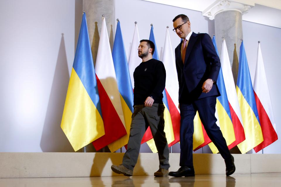 Polish Prime Minister Mateusz Morawiecki, right, welcomes Ukrainian President Volodymyr Zelenskyy as they meet in Warsaw on April 5, 2023.