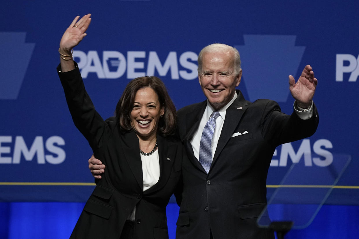 President Joe Biden waves with Vice President Kamala Harris at the Pennsylvania Democratic Party's 3rd Annual Independence Dinner in Philadelphia, Friday, Oct. 28, 2022. (AP Photo/Matt Rourke)