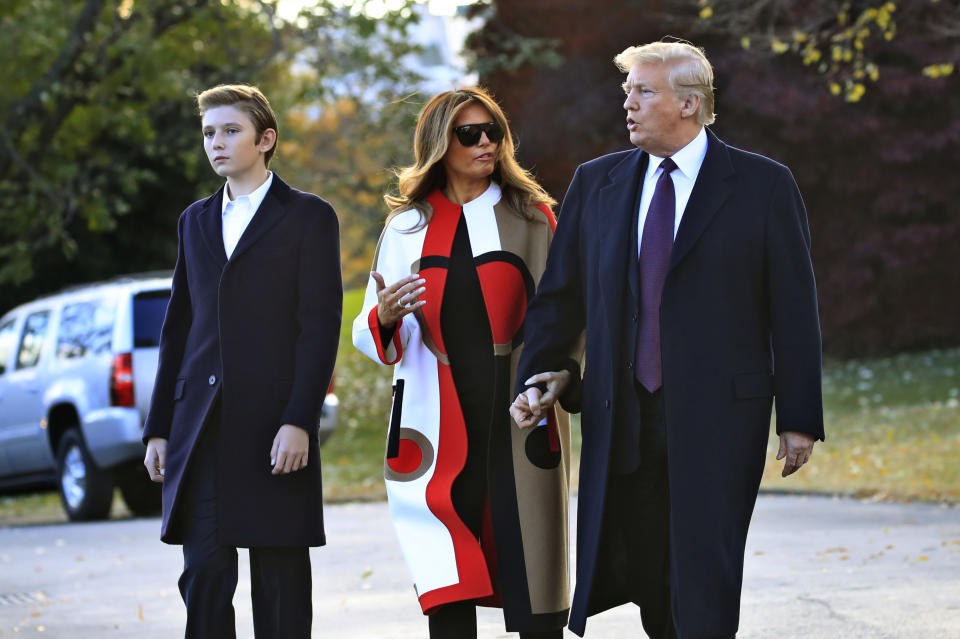 President Donald Trump and first lady Melania Trump with their son Barron Trump talk as they walk on the South Lawn of the White House in Washington, Tuesday, Nov. 20, 2018, to board the Marine One. Trump and his family are traveling to Florida, where they will spend Thanksgiving at Mar-a-Lago. (AP Photo/Manuel Balce Ceneta)