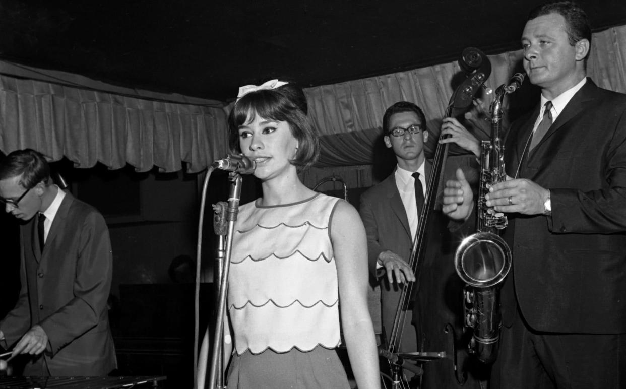 Astrud Gilberto onstage at Birdland in New York in 1964 with Stan Getz, far right, and his band, including Gary Burton on vibraphone and Gene Cherico on bass - PoPsie Randolph/Michael Ochs Archives/Getty Images