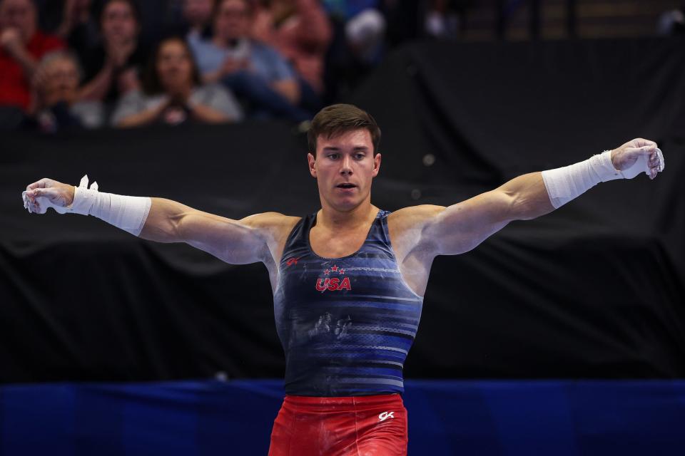 Brody Malone competes on the high bar.