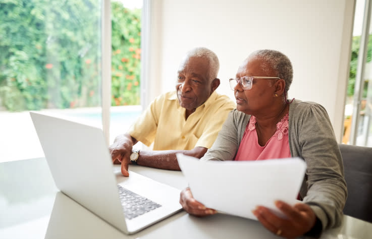 A senior couple researching documents to create a power of attorney in Florida.
