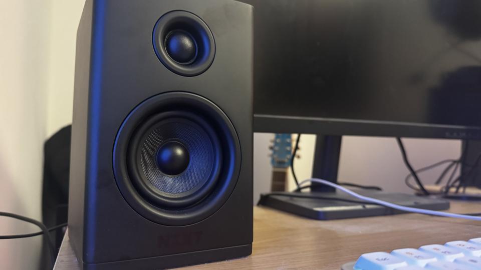 The right speaker of the NZXT Relay was set on a wooden desk