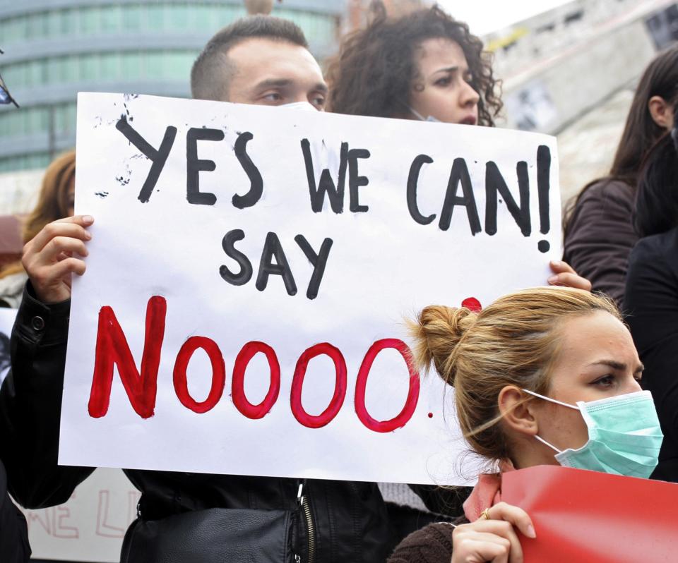 Demonstrators protest against the dismantling of Syria's chemical weapons in Albania, in front of the U.S. embassy in Tirana