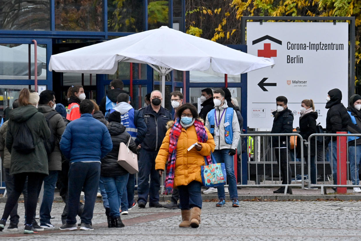 People queue up in front of the vaccination centre at the Messe Berlin fairgrounds on November 24, 2021 in Berlin, amid the ongoing novel coronavirus / Covid-19 pandemic. (Photo by John MACDOUGALL / AFP) (Photo by JOHN MACDOUGALL/AFP via Getty Images)