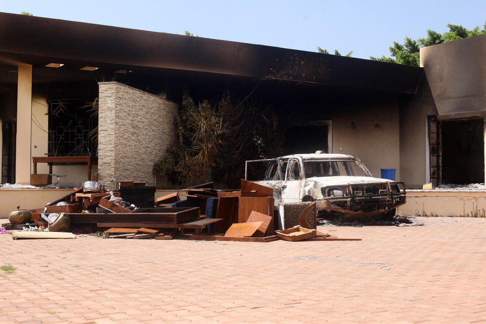 A burnt car is seen after an attack on the U.S. Consulate by protesters in Benghazi, Libya, Wednesday, Sept. 12, 2012. (AP Photo/Ibrahim Alaguri)