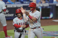 Los Angeles Angels' Logan O'Hoppe (14) scores during the ninth inning of a baseball game against the Miami Marlins, Monday, April 1, 2024, in Miami. (AP Photo/Marta Lavandier)