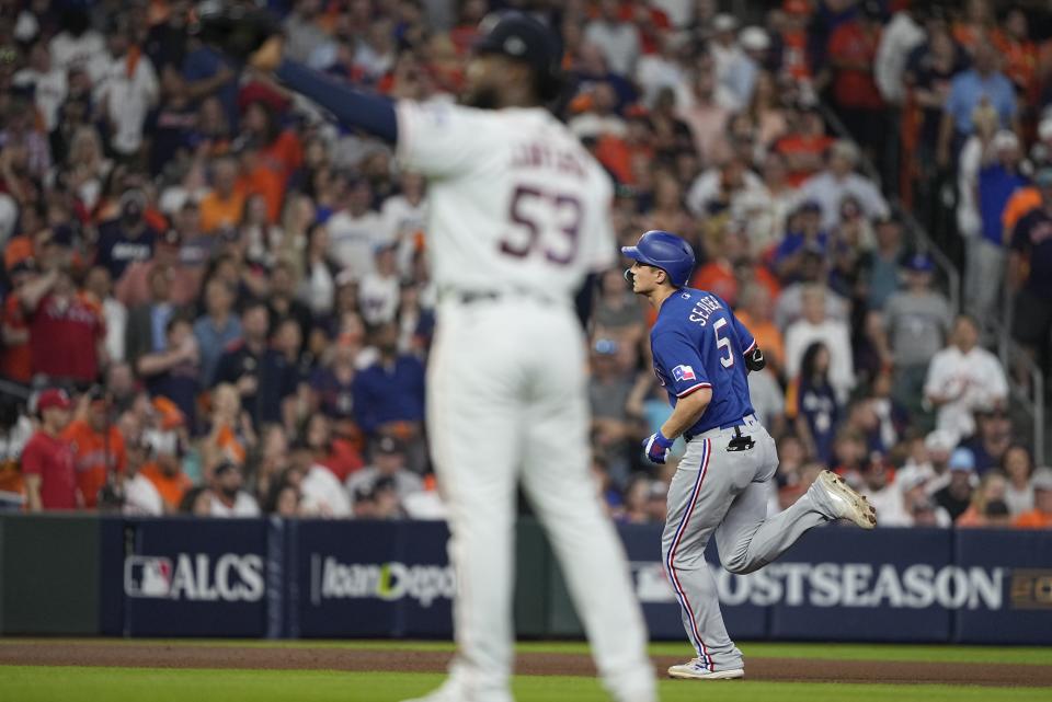 Texas Rangers' Corey Seager hits a home run during the first inning of Game 6 of the baseball AL Championship Series against the Houston Astros Monday, Oct. 23, 2023, in Houston. (AP Photo/David J. Phillip)