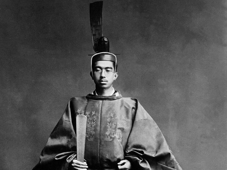 Emperor Hirohito in uniform with a headpiece on.