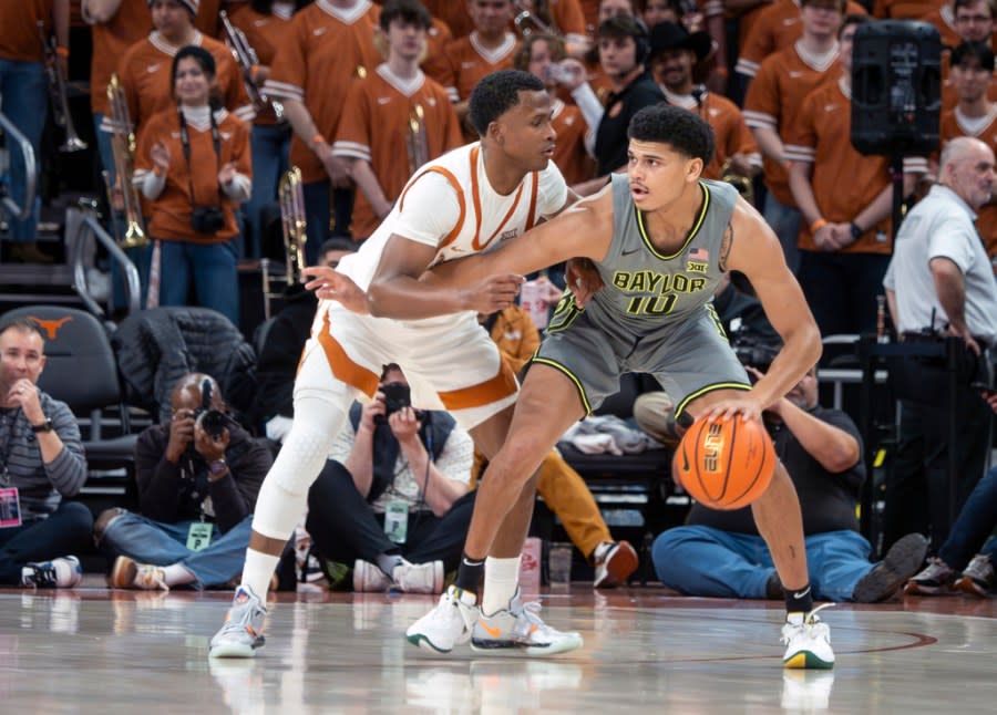 Baylor guard Rayj Dennis, right, plays against Texas guard Max Abmas, left, during the second half of an NCAA college basketball game, Saturday, Jan. 20, 2024, in Austin, Texas. Texas won 75-73. (AP Photo/Michael Thomas)