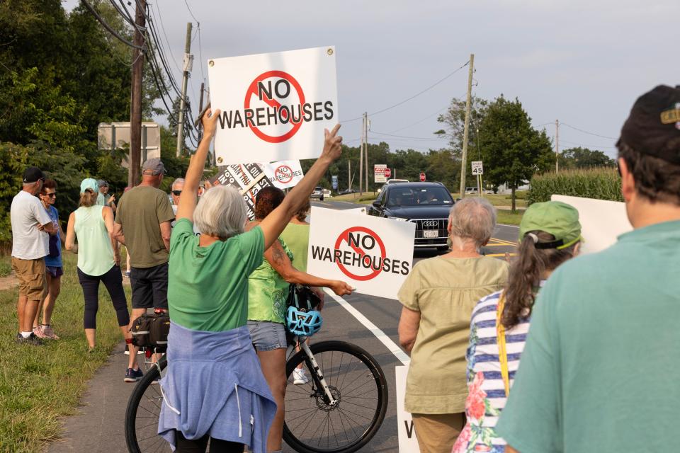 Protesters line Main Street in August 2023 just outside of Allentown near where developers are proposing to build a warehouse in neighboring Upper Freehold. Many are concerned about the impact on local traffic and sights connected with the 1778 Battle of Monmouth.