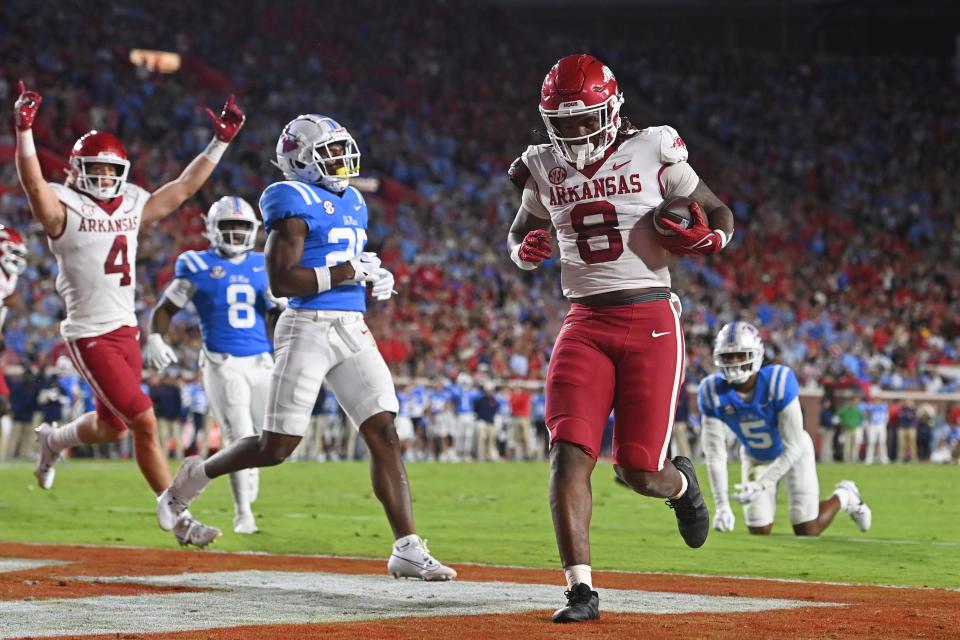 Arkansas tight end Ty Washington (8) carries the ball into the end zone for a 3-yard touchdown reception during the first half of an NCAA college football game against Mississippi in Oxford, Miss., Saturday, Oct. 7, 2023. (AP Photo/Thomas Graning)