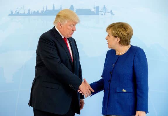 German Chancellor Angela Merkel (R) and US President Donald Trump  shake hands prior to a bilateral meeting on the eve of the G20 summit in Hamburg, northern Germany, on July 6, 2017. Leaders of the world's top economies will gather from July 7 to 8, 2017 in Germany for likely the stormiest G20 summit in years, with disagreements ranging from wars to climate change and global trade. / AFP PHOTO / POOL / Michael Kappeler        (Photo credit should read MICHAEL KAPPELER/AFP/Getty Images)