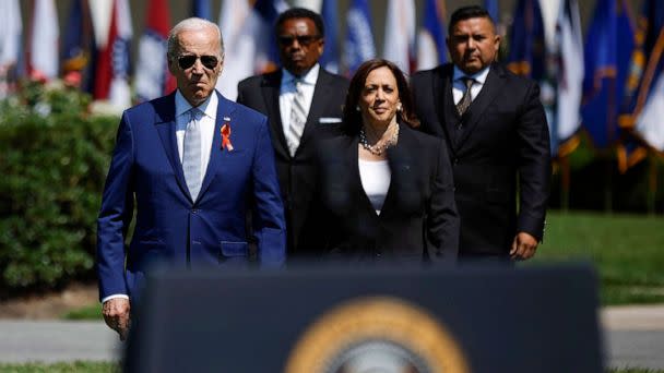 PHOTO: President Joe Biden, Garnell Whitfield Jr., Vice President Kamala Harris and Dr. Dr. Roy Guerrero arrive for an event to celebrate the Bipartisan Safer Communities Act on the South Lawn of the White House, July 11, 2022. (Chip Somodevilla/Getty Images)