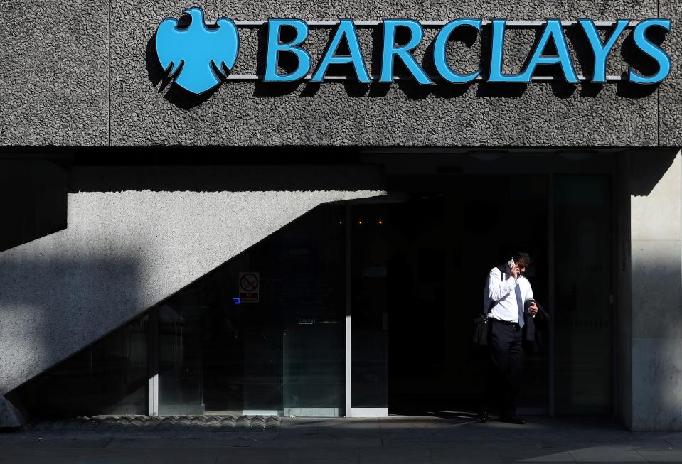 A pedestrian walks past a branch of Barclays bank in central London. Photo: DANIEL LEAL-OLIVAS/AFP/Getty Images