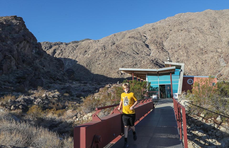 A young visitor leaves the  Tahquitz Canyon Visitor Center in Palm Springs, Nov. 24, 2021.