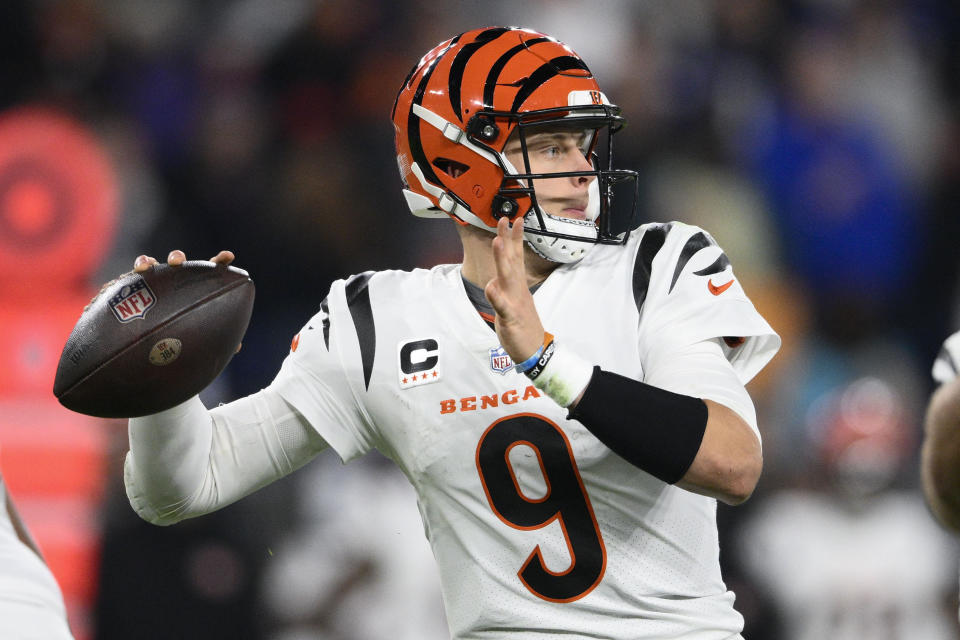 Cincinnati Bengals quarterback Joe Burrow couldn't grip the ball on the sideline after injuring his wrist. (AP Photo/Nick Wass)