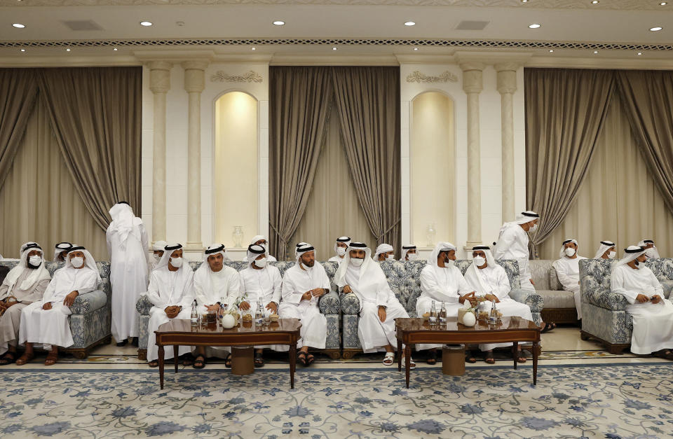 People gather to mourn the death of Sheikh Khalifa Bin Zayed Al Nahyan at Al Mushrif Palace in Abu Dhabi, United Arab Emirates, Sunday, May 15, 2022. (Christian Hartmann, Pool via AP)