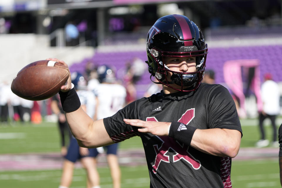 Troy quarterback Gunnar Watson warms up before the Cure Bowl NCAA college football game against UTSA, Friday, Dec. 16, 2022, in Orlando, Fla. (AP Photo/John Raoux)