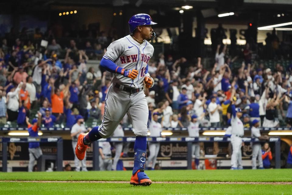 New York Mets' Francisco Lindor hits a grand slam during the seventh inning of a baseball game against the Milwaukee Brewers Tuesday, Sept. 20, 2022, in Milwaukee. (AP Photo/Morry Gash)