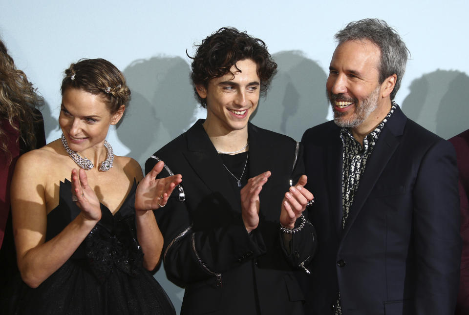 Rebecca Ferguson, from left, Timothee Chalamet, and director Denis Villeneuve poses for photographers upon arrival at the premiere of the film 'Dune' on Monday, Oct. 18, 2021 in London. (Photo by Joel C Ryan/Invision/AP)